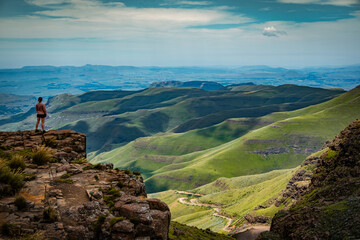 Woman contemplating the hills from Sani Pass in the Drakensberg, South Africa