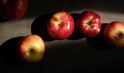 Red apples. Colorful apples in close-up on a dark background. Fine art photography.