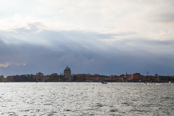 Lido island viewed from Venetian lagoon. The Votive Temple church or Tempio Votivo della Pace di Venezia on Lido island of Venice, Italy