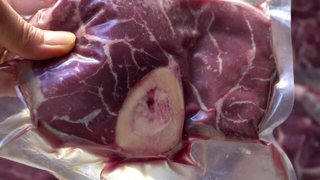 Close-up of vacuum-sealed packaging organic beef (osso buco)