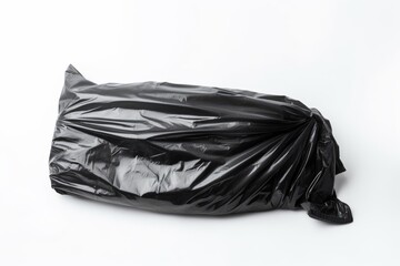 A sealed black plastic garbage bag isolated on a white background. Black Plastic Waste Bag Isolated