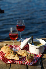 Picnic on the river with liver pate and wine