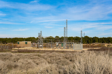 Electrical Substation in a Grassy Field: A Nexus of Energy Distribution