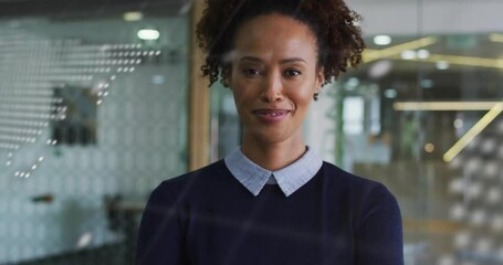 Animation of financial data processing over biracial businesswoman in office - Powered by Adobe
