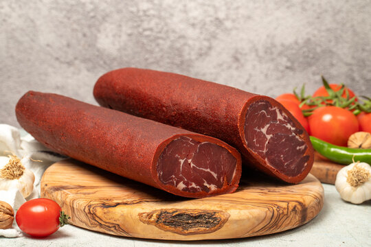 Turkish pastrami. Traditional Turkish cuisine flavors. Bacon on a cutting board. local name sivas pastirma