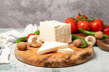 Full fat cow cheese. Fresh cow cheese on cutting board