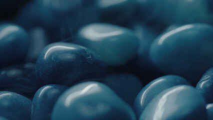 Blue gemstones rotating with a foggy atmosphere around them