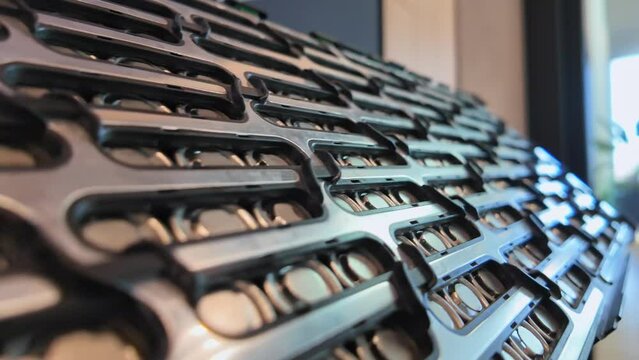 Close-up of Electric Car battery pack. Lithium-ion battery cell manufacturing and battery module cells for automotive Industry. High capacity batteries for Electric Vehicle.