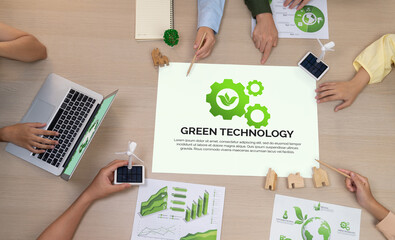 Green technology illustration placed on a meeting table during a green business meeting discussion....