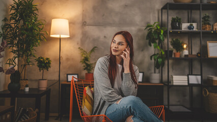 one young woman at home use mobile phone smartphone have a call talk