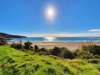 Fototapeta na wymiar Experience the laid-back charm of Raglan Beach, renowned for its surfing, scenic beauty, and relaxed coastal atmosphere in New Zealand.