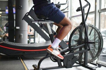 healthy african american man exercising in gym