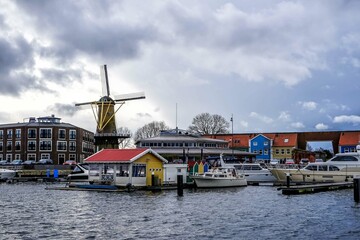 Fortified harbor in Hellevoetsluis with windmill. 
Hellevoetsluis, Hellevoet, Voorne aan Zee, South Holland, Netherlands, Holland, Europe.
