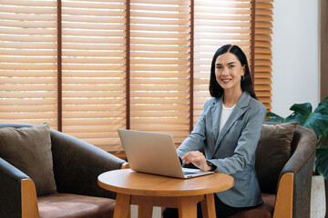 Portrait of happy and smiling female psychologist portrait using laptop for online video call on...