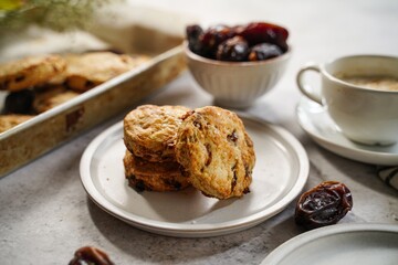 Homemade date scones served with cup of coffee and fresh date fruits