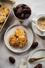 Homemade date scones served with cup of coffee and fresh date fruits