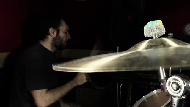 Drummer who plays with ride cymbal in the foreground