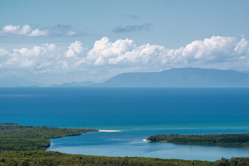 Discover the tranquil beauty of the Daintree River Mouth, where lush rainforest meets the azure waters of Queensland, Australia.