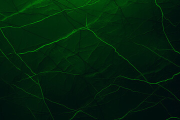 Green grunge banner. Abstract stone wall texture background. Close-up shot with neon veins. Dark rock backdrop with copy space for designs