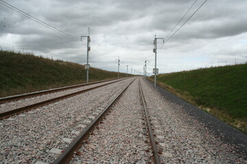 Obraz premium New fast railroad tracks in the countryside