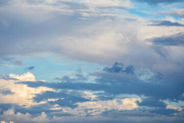 Naklejka na ściany i meble Dramatic sky with beautiful and exotic clouds