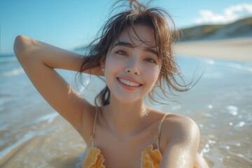 Very beautiful woman in a summer dress She smiled and raised her arms with pride. she at the beach