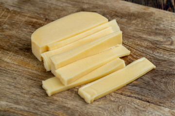 hard cheese cut into long thin slices