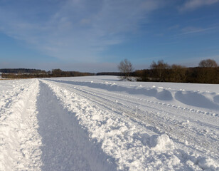 Fototapeta na wymiar winter road after snowfall in sunny weather