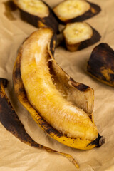 an overripe dark banana that is spoiling