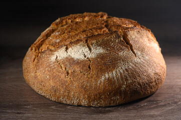appetizing homemade whole grain bread on a wooden table 11