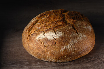 appetizing homemade whole grain bread on a wooden table 12