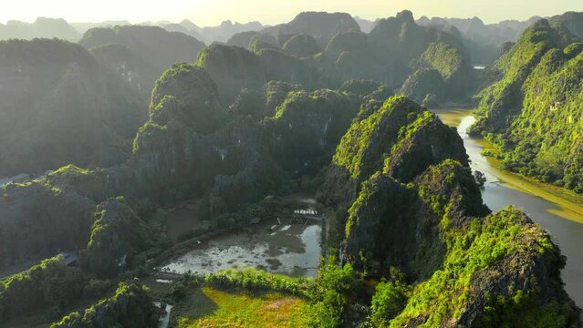 beautiful aerial view of sunset in Ninh Binh in Vietnam, UNESCO World Heritage Site in Vietnam, drone view of Tam Com