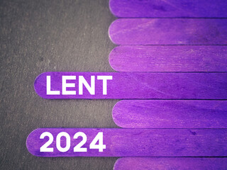 Lent Season,Holy Week and Good Friday Concepts. Lent 2024 text on purple wooden sticks background....