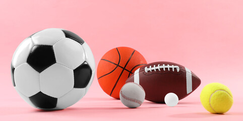 Many different sports balls on pink background. Banner design