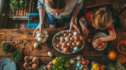 Poster mother and daughter child family prepare easter eggs at home © Miljan Živković