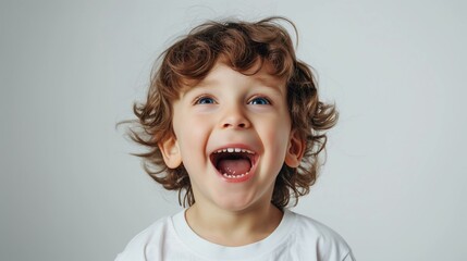 Happy Toddler Boy Laughing with Excitement, Isolated on White Background