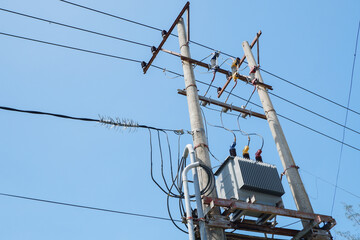 Electrical substation with bright blue sky background