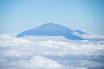 Mt. Meru’s Silent Vigil Above the Clouds