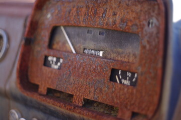 Running on empty an old instrument panel on a wrecked car from the 1960 era.