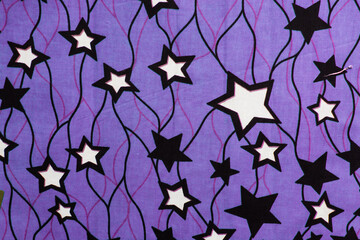 top view of purple ankara fabric, flatlay of nigerian wax cloth with designs, spread out purple ankara material