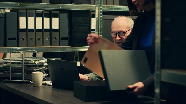 Forensic team examining classified documents and medical records, working on reenacting crime scene timeline to find suspect. Inspector and law agent conducting investigation. Camera A.