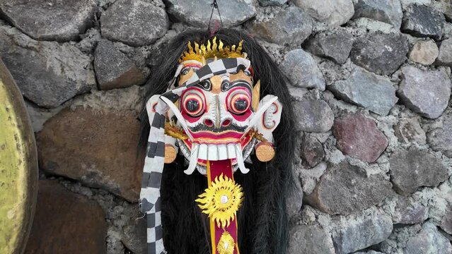 Traditional Leak Rangda Mask costume for a Bali Dance theater performance. Handcrafted masks in the form of legendary demons in Bali, Indonesia.