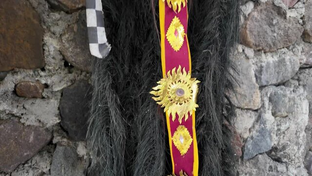 Traditional Leak Rangda Mask costume for a Bali Dance theater performance. Handcrafted masks in the form of legendary demons in Bali, Indonesia.