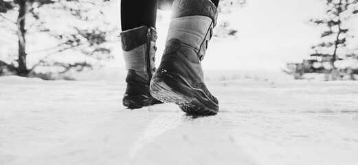 Womens winter jackboots. Black and white toned image 
