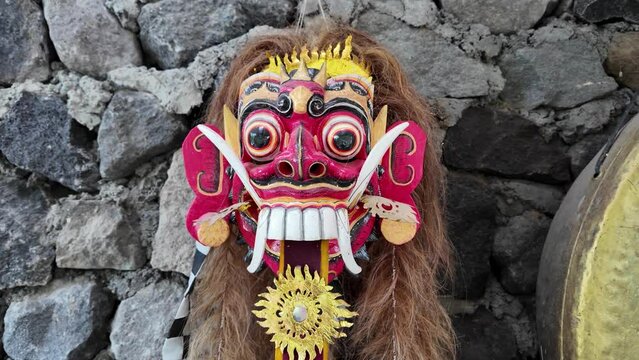 Traditional Leak Rangda Mask costume for a Bali Dance theater performance. Handcrafted masks in the form of legendary demons in Bali, Indonesia.