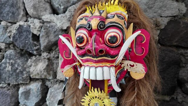 Traditional Leak Rangda Mask costume for a Bali Dance theater performance. Handcrafted masks in the form of legendary demons in Bali, Indonesia.