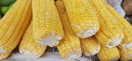 Fresh yellow corn cobs sold in traditional market Indonesia