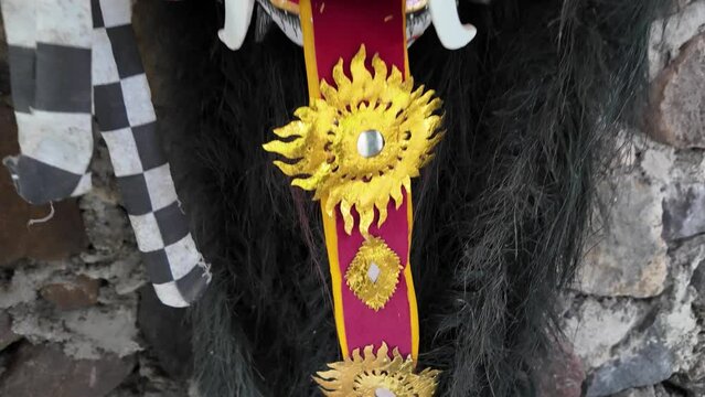 Traditional Leak Rangda Mask costume for a Bali Dance theater performance. Handcrafted masks in the form of legendary demons in Bali, Indonesia.