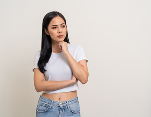 Upset confused bad emotional and thinking asian woman. Unhappy stressed female. Young latin lady standing feeling depressed dramatic scene on isolated background.