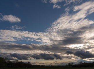 Fototapeta premium Tragic gloomy sky over the city. Panorama. Storm clouds cover the landscape. Tragic gloomy sky.